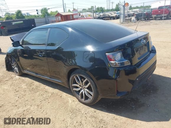 ✅ 2015 Scion tC • VIN: JTKJF5C7XFJ000690 • Lot: 42816428. Listed on IAAI with 181,743 mi. Free auction sales archive from the USA and detailed vehicle history report at DreamBid. Image 3.