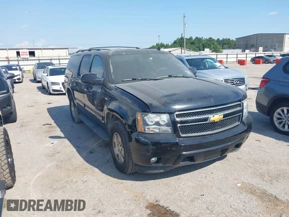 2014 Chevrolet Suburban LT z VIN 1GNSCJE05ER195862, wystawiony jako IAAI lot #43210972 z przebiegiem 296 051 mil mil oraz . Historia ofert i sprzedaży dostępna na DreamBid. Obrazek 1.