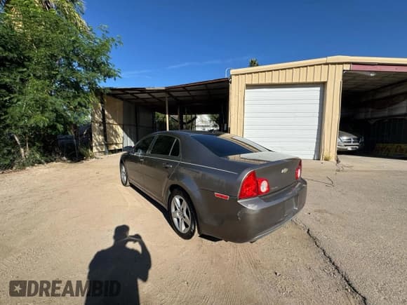 ✅ 2012 Chevrolet Malibu 1LS • VIN: 1G1ZB5E06CF184197 • Lot: 93242365. Listed on Copart with 233,534 mi. Free auction sales archive from the USA and detailed vehicle history report at DreamBid. Image 3.