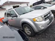 ✅ 2010 Ford Escape XLT • VIN: 1FMCU0DG8AKA46928 • Lot: 43675394. Listed on IAAI with 184,729 mi. Free auction sales archive from the USA and detailed vehicle history report at DreamBid. Image 1.