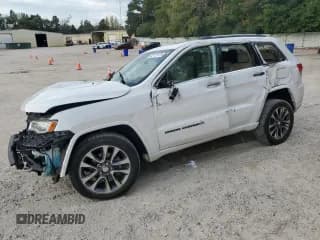 ✅ 2017 Jeep Grand Cherokee Overland • VIN: 1C4RJFCGXHC658113 • Lot: 82111175. Listed on Copart with 113,507 mi. Free auction sales archive from the USA and detailed vehicle history report at DreamBid. Image 1.