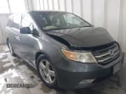 ✅ 2012 Honda Odyssey Touring • VIN: 5FNRL5H92CB106325 • Lot: 43287538. Listed on IAAI with 206,962 mi. Free auction sales archive from the USA and detailed vehicle history report at DreamBid. Image 1.