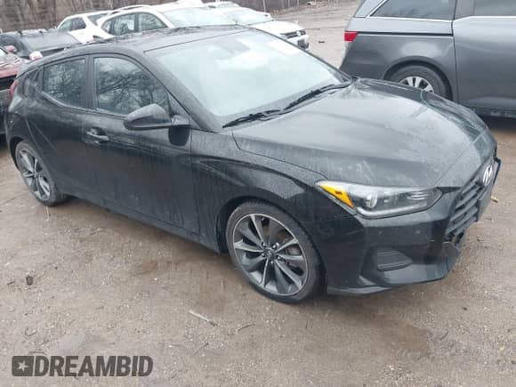 2019 Hyundai Veloster Premium z VIN KMHTG6AF0KU019038, wystawiony jako IAAI lot #41236750 z przebiegiem 83 164 mil mil oraz . Historia ofert i sprzedaży dostępna na DreamBid. Obrazek 1.