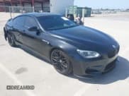 ✅ 2014 BMW M6 • VIN: WBS6C9C52EDV73651 • Lot: 42110470. Listed on IAAI with 127,576 mi. Free auction sales archive from the USA and detailed vehicle history report at DreamBid. Image 1.