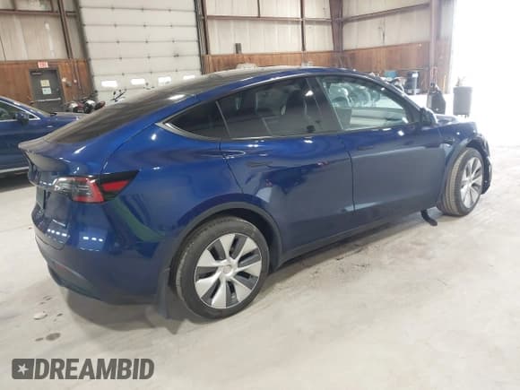 ✅ 2023 Tesla Model Y Long Range • VIN: 7SAYGDEE0PA124551 • Lot: 42331624. Listed on IAAI with 27,828 mi. Free auction sales archive from the USA and detailed vehicle history report at DreamBid. Image 4.