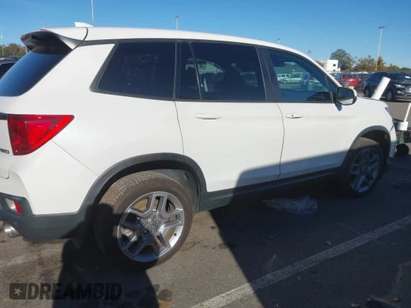 ✅ 2023 Honda Passport EX-L • VIN: 5FNYF8H53PB014146 • Lot: 43469474. Listed on IAAI with 32,713 mi. Free auction sales archive from the USA and detailed vehicle history report at DreamBid. Image 4.