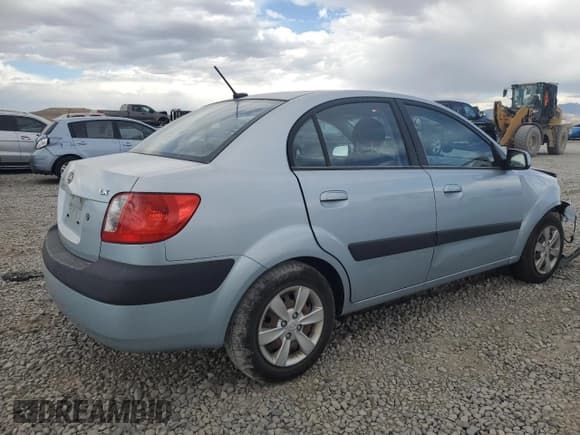 ✅ 2009 Kia Rio LX • VIN: KNADE223496469797 • Лот: 71005774. Опубликован ранее на Copart с пробегом 130 675 миль. Бесплатный доступ к архиву аукционных продаж из США и подробный отчёт об истории автомобиля на DreamBid. Изображение 3.