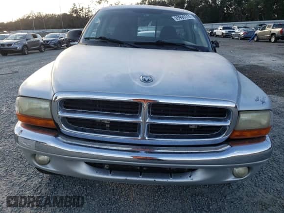 2003 Dodge Dakota с VIN 1D7GG16X33S130101, выставлен на аукционе Copart как лот 85999314 с пробегом 221 292 миль миль и Списание • Salvage title. История ставок и продаж доступна на DreamBid. Изображение 5.