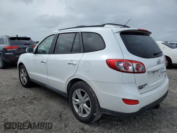 ✅ 2012 Hyundai Santa Fe Limited • VIN: 5XYZKDAG1CG143185 • Lot: 74531934. Listed on Copart with 186,312 mi. Free auction sales archive from the USA and detailed vehicle history report at DreamBid. Image 2.