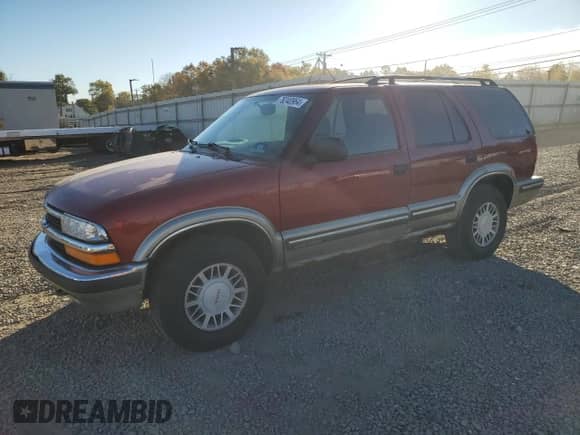 1999 Chevrolet Blazer LS z VIN 1GNDT13WXX2119758, wystawiony jako Copart lot #76240964 z przebiegiem 162 369 mil mil oraz Szkoda całkowita • Salvage title. Historia ofert i sprzedaży dostępna na DreamBid. Obrazek 1.