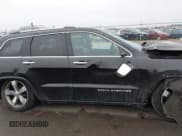 ✅ 2015 Jeep Grand Cherokee Overland • VIN: 1C4RJFCG3FC665854 • Lot: 41697999. Listed on IAAI with 206,618 mi. Free auction sales archive from the USA and detailed vehicle history report at DreamBid. Image 13.