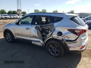 ✅ 2018 Hyundai Santa Fe 2.4L • VIN: 5XYZUDLB4JG562382 • Лот: 60466234. Опубликован ранее на Copart с пробегом 85 365 миль. Бесплатный доступ к архиву аукционных продаж из США и подробный отчёт об истории автомобиля на DreamBid. Изображение 2.