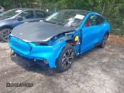 ✅ 2022 Ford Mustang Mach-E Premium • VIN: 3FMTK3R77NMA28340 • Lot: 42233063. Listed on IAAI with 22,893 mi. Free auction sales archive from the USA and detailed vehicle history report at DreamBid. Image 2.