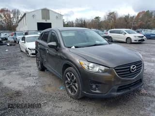 ✅ 2016 Mazda CX-5 Grand Touring • VIN: JM3KE4DY6G0738999 • Lot: 43670069. Listed on IAAI with 168,251 mi. Free auction sales archive from the USA and detailed vehicle history report at DreamBid. Image 1.