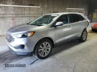 ✅ 2023 Ford Edge Titanium • VIN: 2FMPK4K91PBA29393 • Лот: 70289525. Опубликован ранее на Copart с пробегом 64 197 миль. Бесплатный доступ к архиву аукционных продаж из США и подробный отчёт об истории автомобиля на DreamBid. Изображение 1.