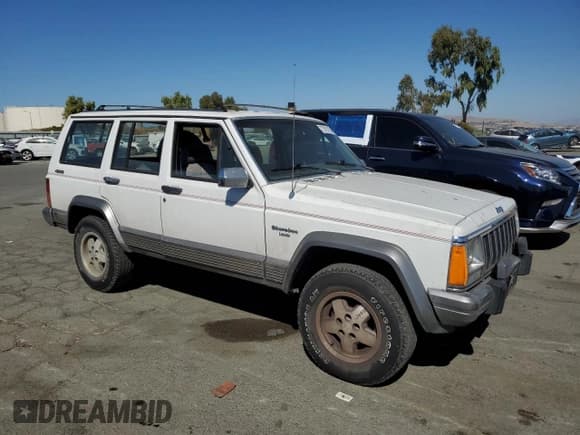 ✅ 1990 Jeep Cherokee Laredo • VIN: 1J4FJ58L3LL206400 • Лот: 73701784. Опубликован ранее на Copart с пробегом 205 067 миль. Бесплатный доступ к архиву аукционных продаж из США и подробный отчёт об истории автомобиля на DreamBid. Изображение 4.