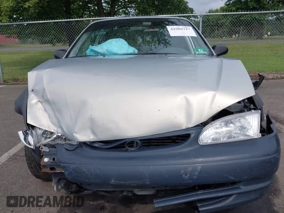 ✅ 1999 Toyota Corolla VE • VIN: 2T1BR12E9XC180124 • Lot: 42989717. Listed on IAAI with 184,062 mi. Free auction sales archive from the USA and detailed vehicle history report at DreamBid. Image 12.