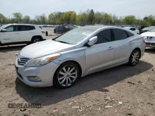 2012 Hyundai Azera z VIN KMHFH4JGXCA173752, wystawiony jako Copart lot #54708955 z przebiegiem 177 711 mil mil oraz Czysty tytuł • Clean title. Historia ofert i sprzedaży dostępna na DreamBid. Obrazek 1.