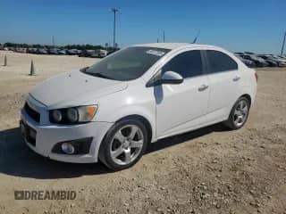 2012 Chevrolet Sonic LTZ z VIN 1G1JE5SH4C4106592, wystawiony jako Copart lot #85377095 z przebiegiem 120 403 mil mil oraz Czysty tytuł • Clean title. Historia ofert i sprzedaży dostępna na DreamBid. Obrazek 1.