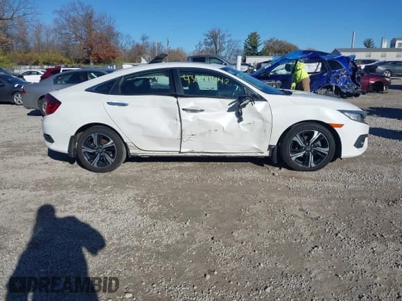 ✅ 2017 Honda Civic Touring • VIN: 19XFC1F93HE018721 • Лот: 43697842. Опубликован ранее на IAAI с пробегом 142 413 миль. Бесплатный доступ к архиву аукционных продаж из США и подробный отчёт об истории автомобиля на DreamBid. Изображение 13.