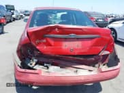 ✅ 2003 Ford Focus LX • VIN: 1FAFP33PX3W241880 • Lot: 42564941. Wystawiony na IAAI z przebiegiem 99 468 mil. Bezpłatny archiwum sprzedaży aukcyjnych z USA i szczegółowy raport historii pojazdu na DreamBid. Zdjęcie 6.