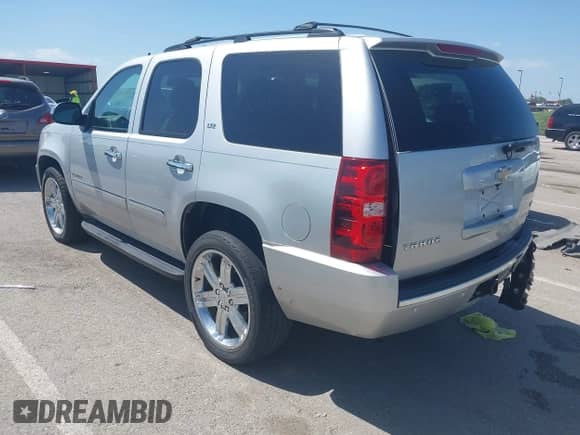 2011 Chevrolet Tahoe LTZ with VIN 1GNSKCE03BR368837, listed as a IAAI auction lot 42741642 with 166,196 mi miles and . Bid and sale history available at DreamBid. Image 3.