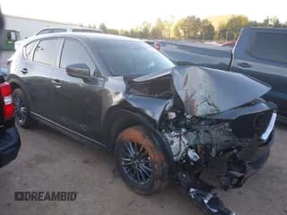 ✅ 2021 Mazda CX-5 Carbon Edition • VIN: JM3KFACM9M0479446 • Lot: 43562414. Listed on IAAI with 27,622 mi. Free auction sales archive from the USA and detailed vehicle history report at DreamBid. Image 1.