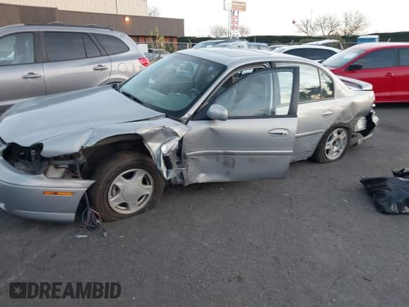2000 Chevrolet Malibu LS z VIN 1G1NE52J6Y6164901, wystawiony jako IAAI lot #41383022 z przebiegiem 47 334 mil mil oraz . Historia ofert i sprzedaży dostępna na DreamBid. Obrazek 2.