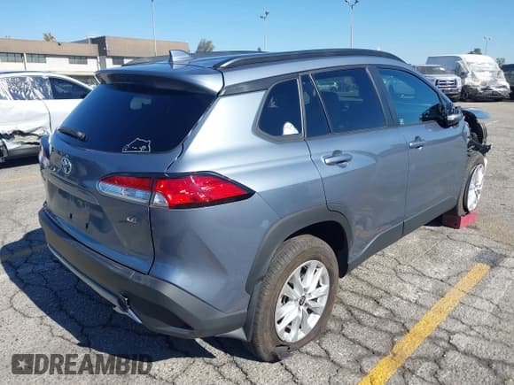 ✅ 2024 Toyota Corolla Cross LE • VIN: 7MUBAAAG5RV074005 • Lot: 43650690. Listed on IAAI with 28,494 mi. Free auction sales archive from the USA and detailed vehicle history report at DreamBid. Image 4.