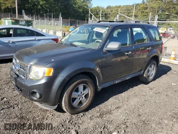 ✅ 2009 Ford Escape XLS • VIN: 1FMCU02789KC80906 • Lot: 84623545. Listed on Copart with 141,224 mi. Free auction sales archive from the USA and detailed vehicle history report at DreamBid. Image 1.