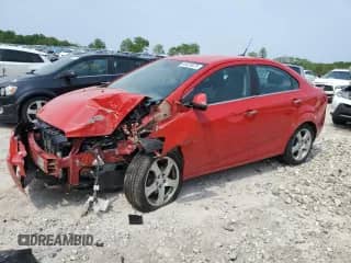 2012 Chevrolet Sonic LTZ z VIN 1G1JE5SH3C4140930, wystawiony jako Copart lot #59429075 z przebiegiem 101 740 mil mil oraz Czysty tytuł • Clean title. Historia ofert i sprzedaży dostępna na DreamBid. Obrazek 1.