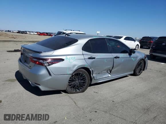 2022 Toyota Camry Hybrid SE с VIN 4T1T31AK8NU033124, выставлен на аукционе Copart как лот 85337245 с пробегом 141 514 миль миль и Списание • Salvage title. История ставок и продаж доступна на DreamBid. Изображение 3.