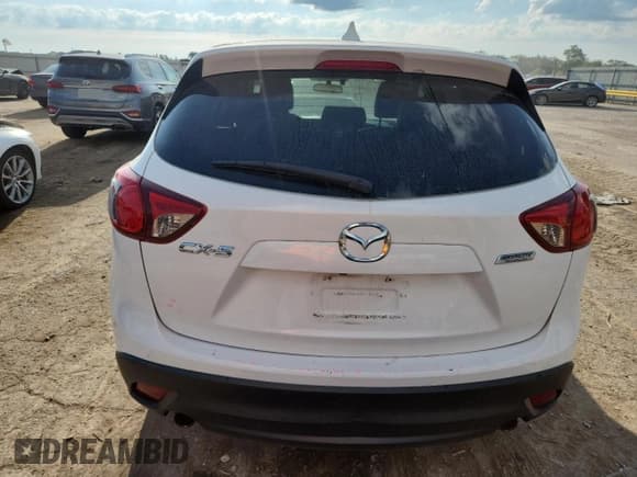 ✅ 2015 Mazda CX-5 Grand Touring • VIN: JM3KE2DYXF0548156 • Лот: 64492935. Опубликован ранее на Copart с пробегом 195 926 миль. Бесплатный доступ к архиву аукционных продаж из США и подробный отчёт об истории автомобиля на DreamBid. Изображение 6.