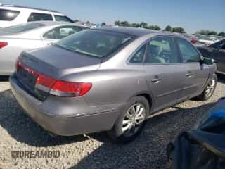 2007 Hyundai Azera SE z VIN KMHFC46F67A185837, wystawiony jako Copart lot #74260854 z przebiegiem 109 970 mil mil oraz Szkoda całkowita • Salvage title. Historia ofert i sprzedaży dostępna na DreamBid. Obrazek 3.