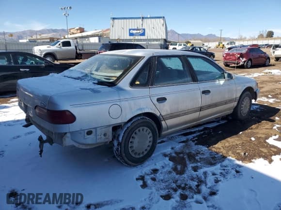 ✅ 1993 Ford Taurus • VIN: 1FACP5242PG162676 • Lot: 45177445. Listed on Copart with 73,771 mi. Free auction sales archive from the USA and detailed vehicle history report at DreamBid. Image 3.