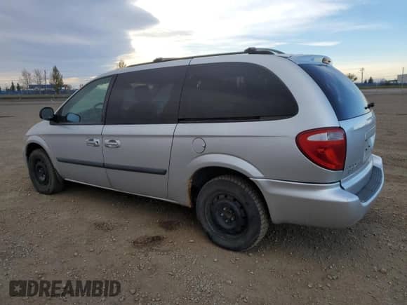 2006 Dodge Grand Caravan SE with VIN 1D4GP24R66B697589, listed as a Copart auction lot 90105685 with 303,817 mi miles and Salvage title. Bid and sale history available at DreamBid. Image 2.
