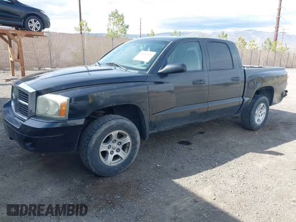 2006 Dodge Dakota SLT with VIN 1D7HE48NX6S596684, listed as a IAAI auction lot 41992956 with 255,526 mi miles and . Bid and sale history available at DreamBid. Image 2.