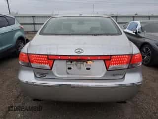 2007 Hyundai Azera SE z VIN KMHFC46FX7A241147, wystawiony jako Copart lot #82863524 z przebiegiem 108 961 mil mil oraz Czysty tytuł • Clean title. Historia ofert i sprzedaży dostępna na DreamBid. Obrazek 6.