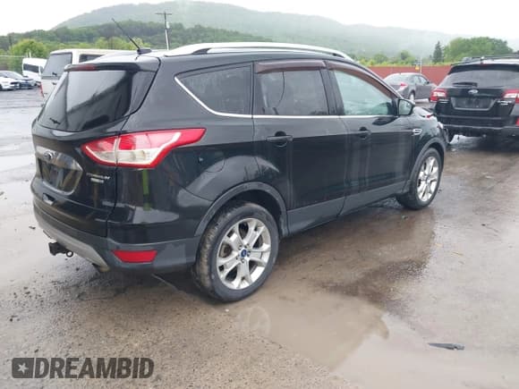 ✅ 2015 Ford Escape Titanium • VIN: 1FMCU9J95FUA75924 • Lot: 42329222. Listed on IAAI with 123,817 mi. Free auction sales archive from the USA and detailed vehicle history report at DreamBid. Image 4.
