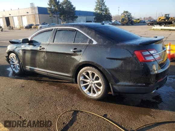 ✅ 2014 Ford Taurus Limited • VIN: 1FAHP2J82EG180438 • Lot: 77816914. Listed on Copart with 130,311 mi. Free auction sales archive from the USA and detailed vehicle history report at DreamBid. Image 2.