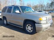 ✅ 2002 GMC Yukon Denali • VIN: 1GKEK63UX2J323023 • Lot: 43787393. Listed on IAAI with 184,795 mi. Free auction sales archive from the USA and detailed vehicle history report at DreamBid. Image 1.