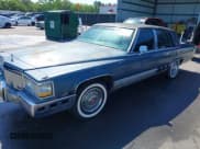 ✅ 1991 Cadillac Brougham • VIN: 1G6DW547XMR708197 • Лот: 42112042. Опубликован ранее на IAAI с пробегом Не указан. Бесплатный доступ к архиву аукционных продаж из США и подробный отчёт об истории автомобиля на DreamBid. Изображение 2.
