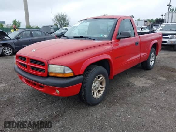2002 Dodge Dakota Sport z VIN 1B7FL36X62S720322, wystawiony jako IAAI lot #42191267 z przebiegiem 108 191 mil mil oraz . Historia ofert i sprzedaży dostępna na DreamBid. Obrazek 2.