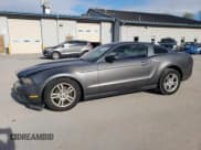 ✅ 2012 Ford Mustang V6 • VIN: 1ZVBP8AM0C5272847 • Lot: 87098715. Listed on Copart with 144,217 mi. Free auction sales archive from the USA and detailed vehicle history report at DreamBid. Image 1.
