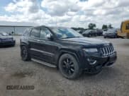 ✅ 2014 Jeep Grand Cherokee Overland • VIN: 1C4RJFCG0EC255463 • Lot: 67548855. Listed on Copart with 202,647 mi. Free auction sales archive from the USA and detailed vehicle history report at DreamBid. Image 4.