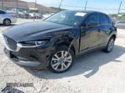 ✅ 2023 Mazda CX-30 S Select • VIN: 3MVDMBBM9PM512587 • Лот: 43169330. Опубликован ранее на IAAI с пробегом 27 499 миль. Бесплатный доступ к архиву аукционных продаж из США и подробный отчёт об истории автомобиля на DreamBid. Изображение 2.