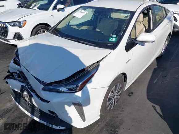 2020 Toyota Prius LE with VIN JTDL9RFU7L3015647, listed as a IAAI auction lot 43500977 with 55,174 mi miles and . Bid and sale history available at DreamBid. Image 2.