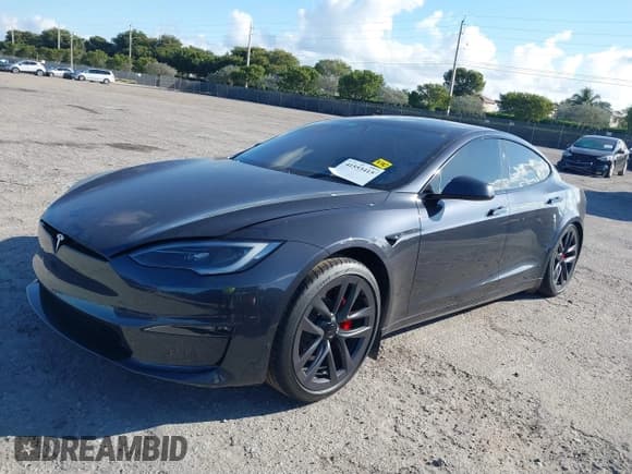✅ 2023 Tesla Model S Plaid • VIN: 5YJSA1E62PF530538 • Lot: 41553415. Listed on IAAI with 31,392 mi. Free auction sales archive from the USA and detailed vehicle history report at DreamBid. Image 2.