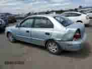 2004 Hyundai Accent GL z VIN KMHCG45C94U574027, wystawiony jako Copart lot #57463905 z przebiegiem 139 595 mil mil oraz Szkoda całkowita • Salvage title. Historia ofert i sprzedaży dostępna na DreamBid. Obrazek 2.