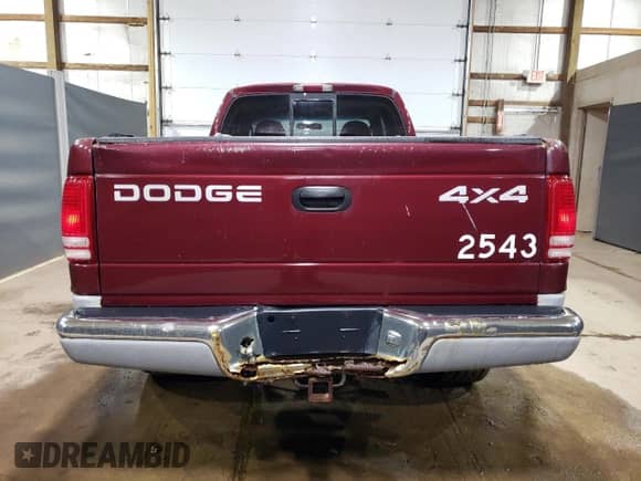 2000 Dodge Dakota Sport z VIN 1B7GG22NXYS573079, wystawiony jako Copart lot #66582204 z przebiegiem 128 435 mil mil oraz Czysty tytuł • Clean title. Historia ofert i sprzedaży dostępna na DreamBid. Obrazek 6.